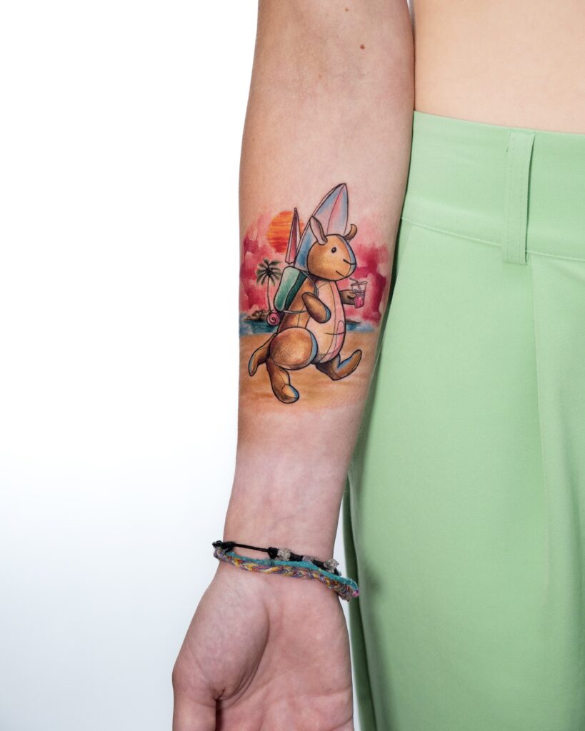 Cartoon bunny with surfboard tattoo