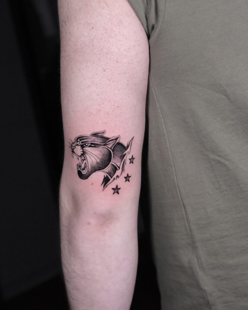 Blackwork Lionhead Tattoo