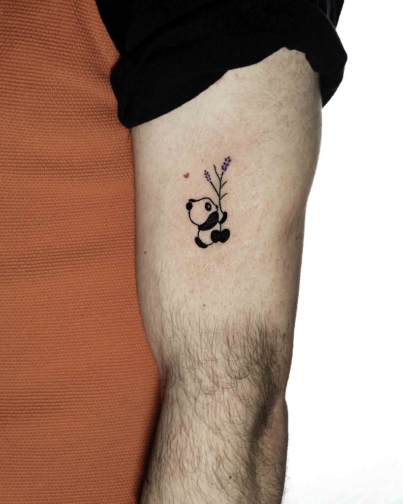 Panda tattoo with flowers and hearts