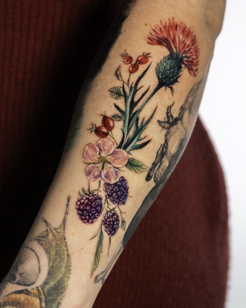 Floral Bouquet Tattoo on arm with natural hue.